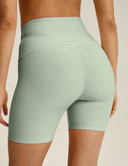 green high-waisted biker shorts with a 5" inseam. 