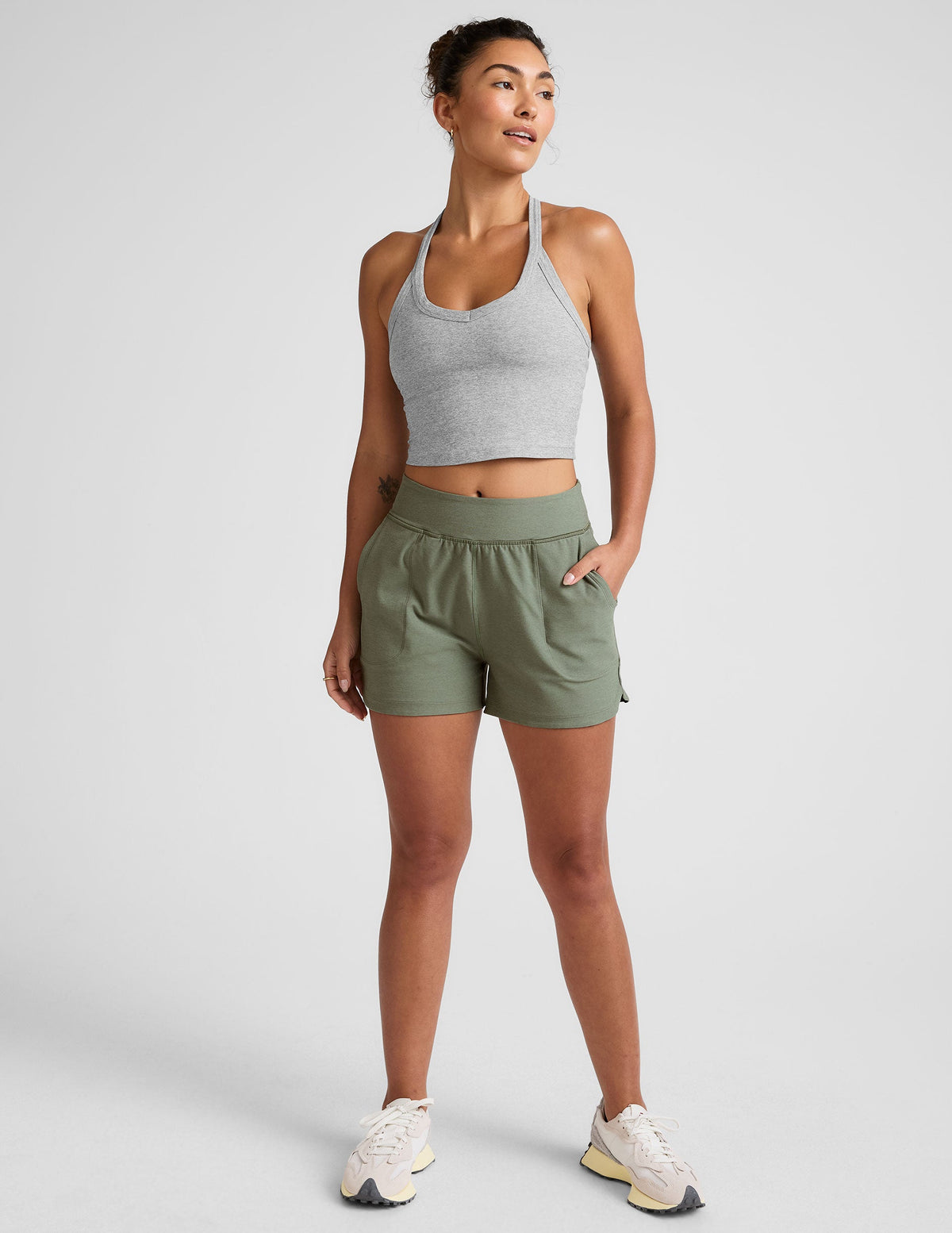 green mid-rise 3" inseam shorts with pockets. 