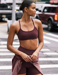 red racerback bra with thin straps.