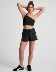 black long line length bra with a one strap detail and open back.