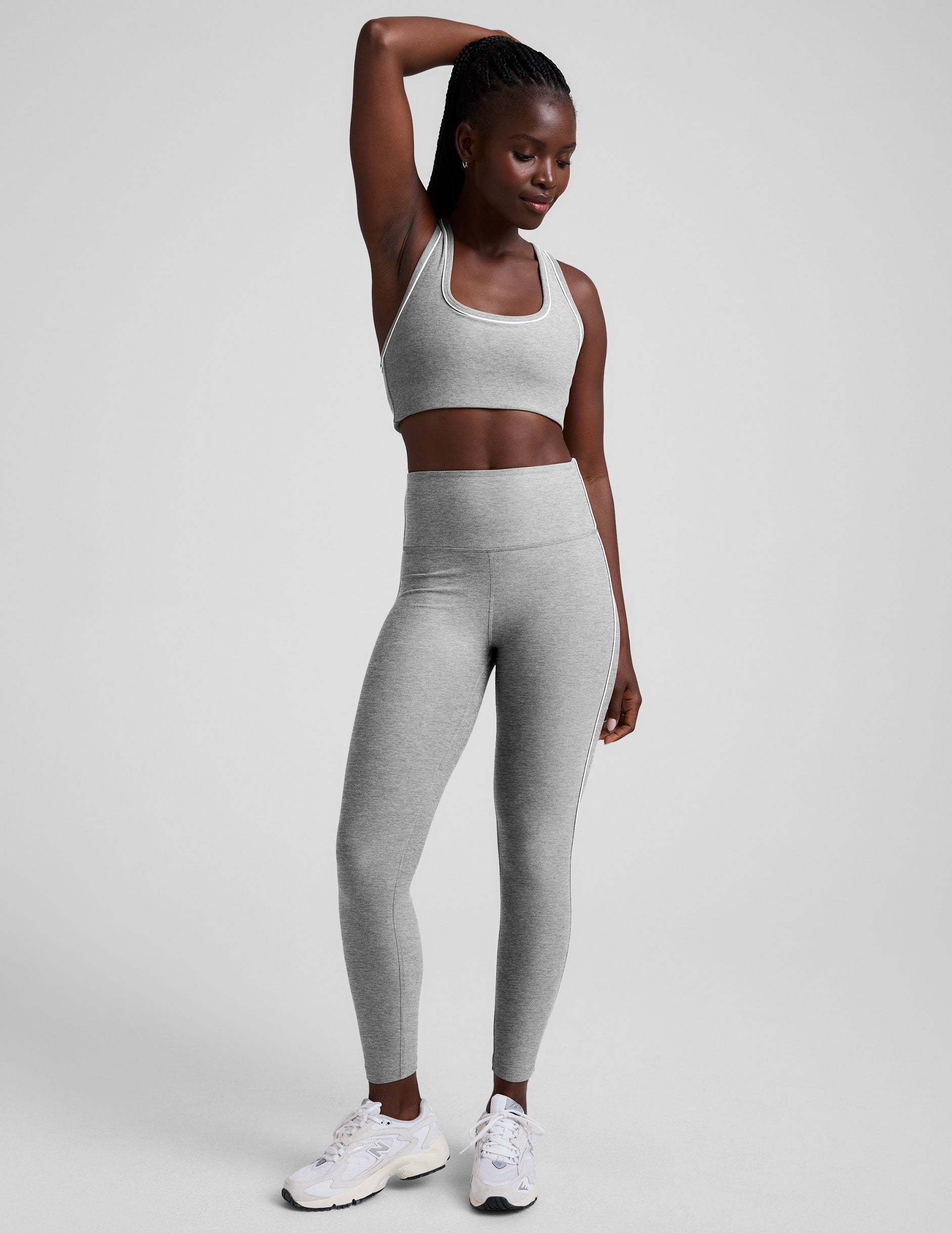 grey scoop neck racerback bra with white contrast trim.
