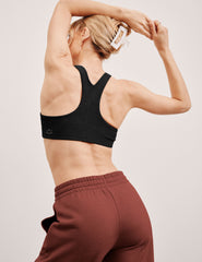 black high-neck racerback bra.