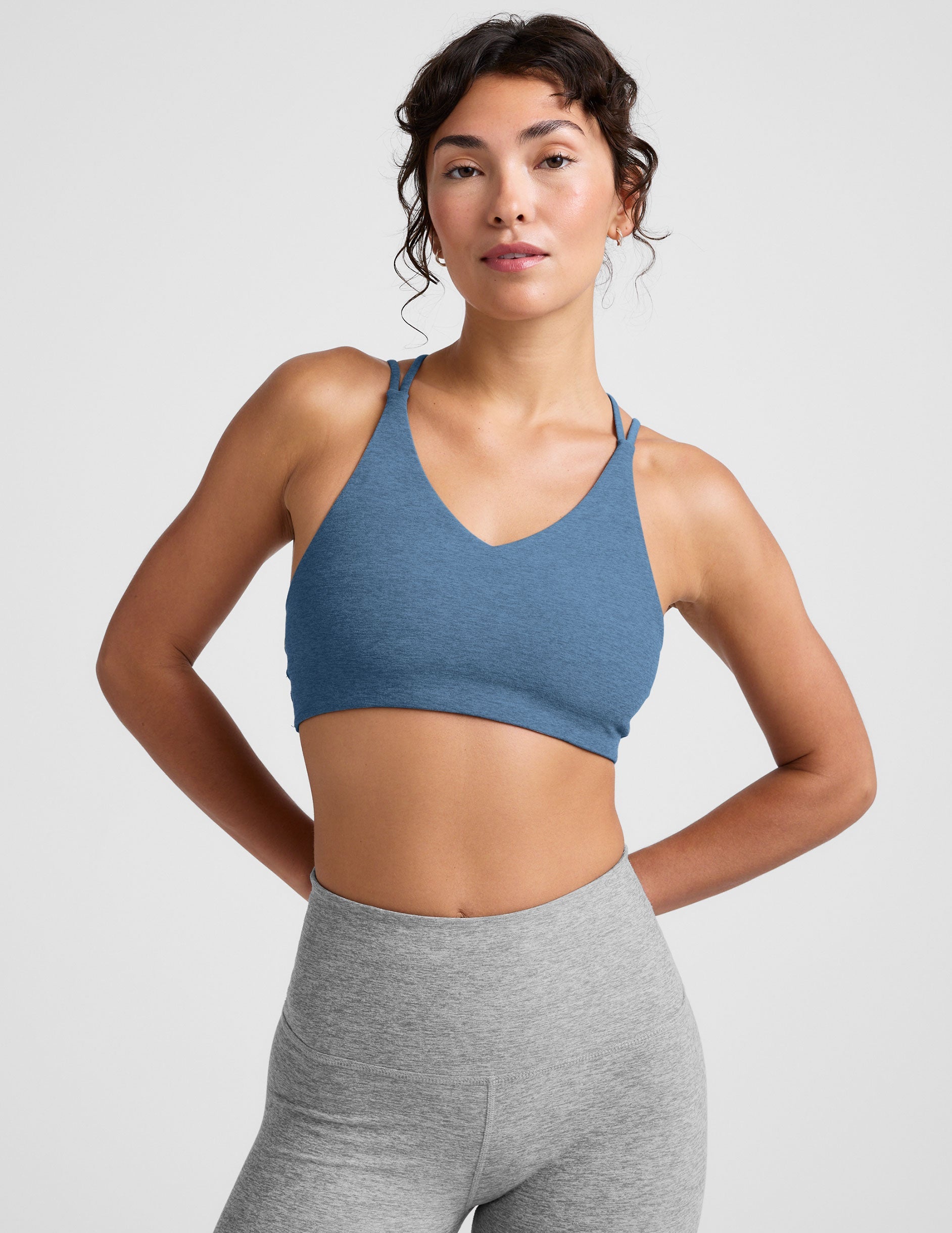 blue v-neck bra with crossover back straps.
