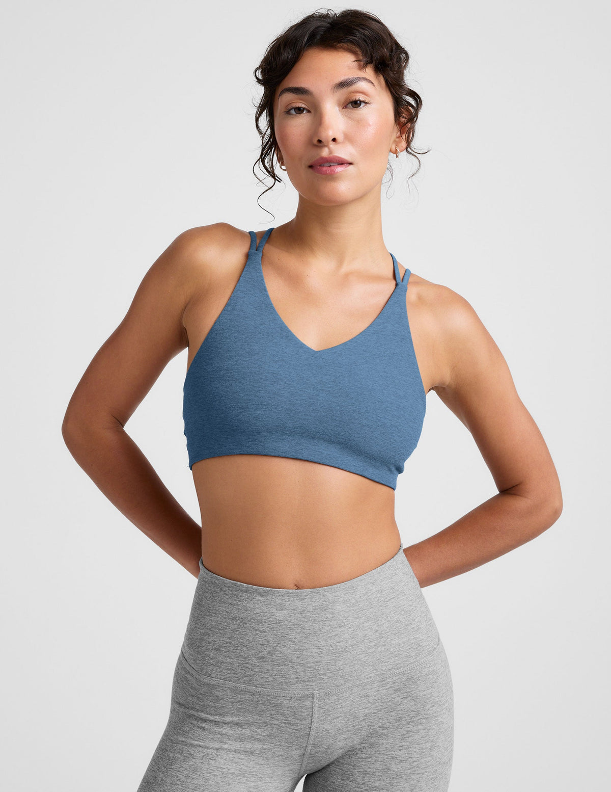 blue v-neck bra with crossover back straps.