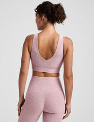 pink long line style bra with a front and back v-neck.