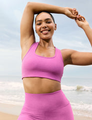 pink medium support racerback bra with a 2" hemband. 