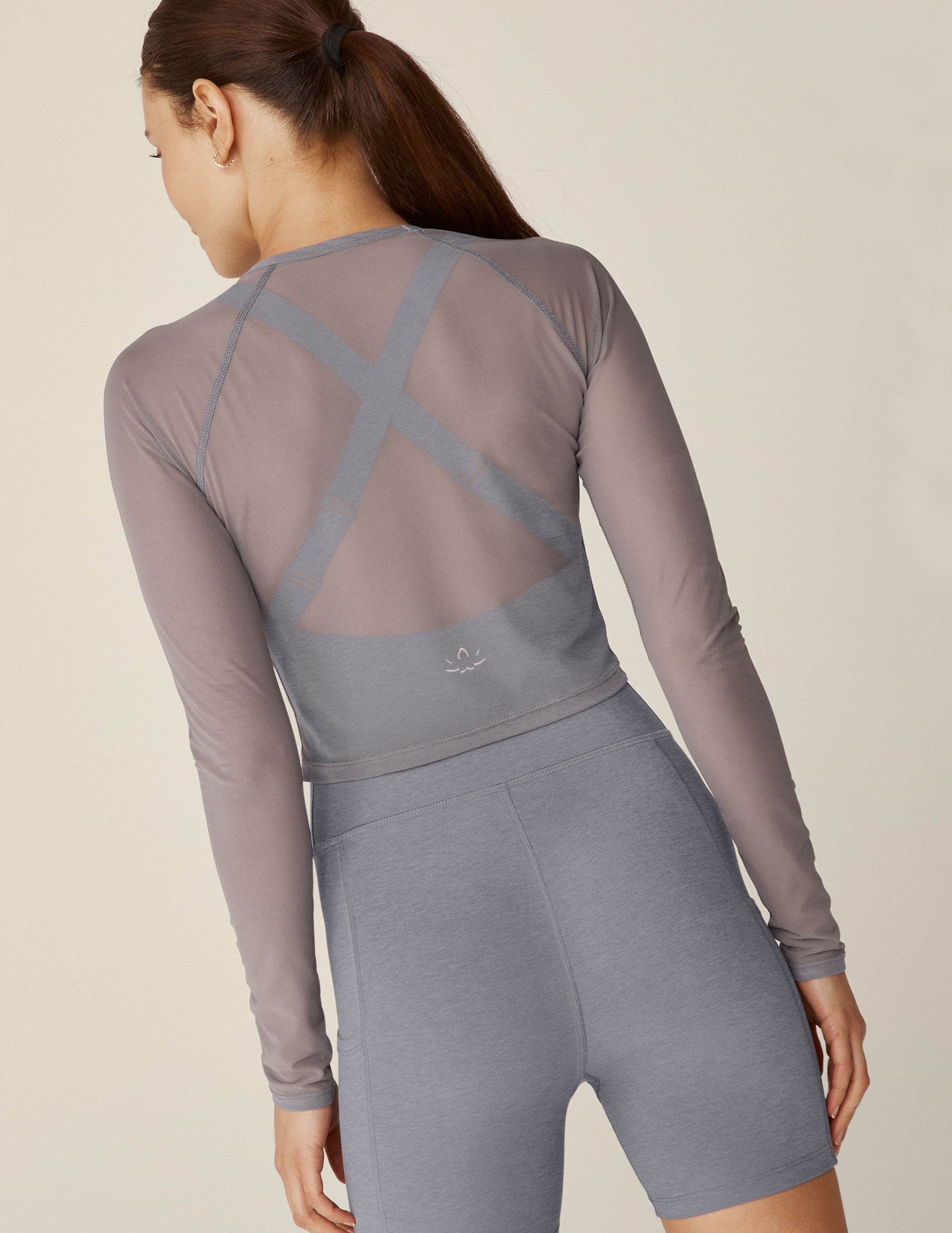 gray long sleeve mesh cropped top.
