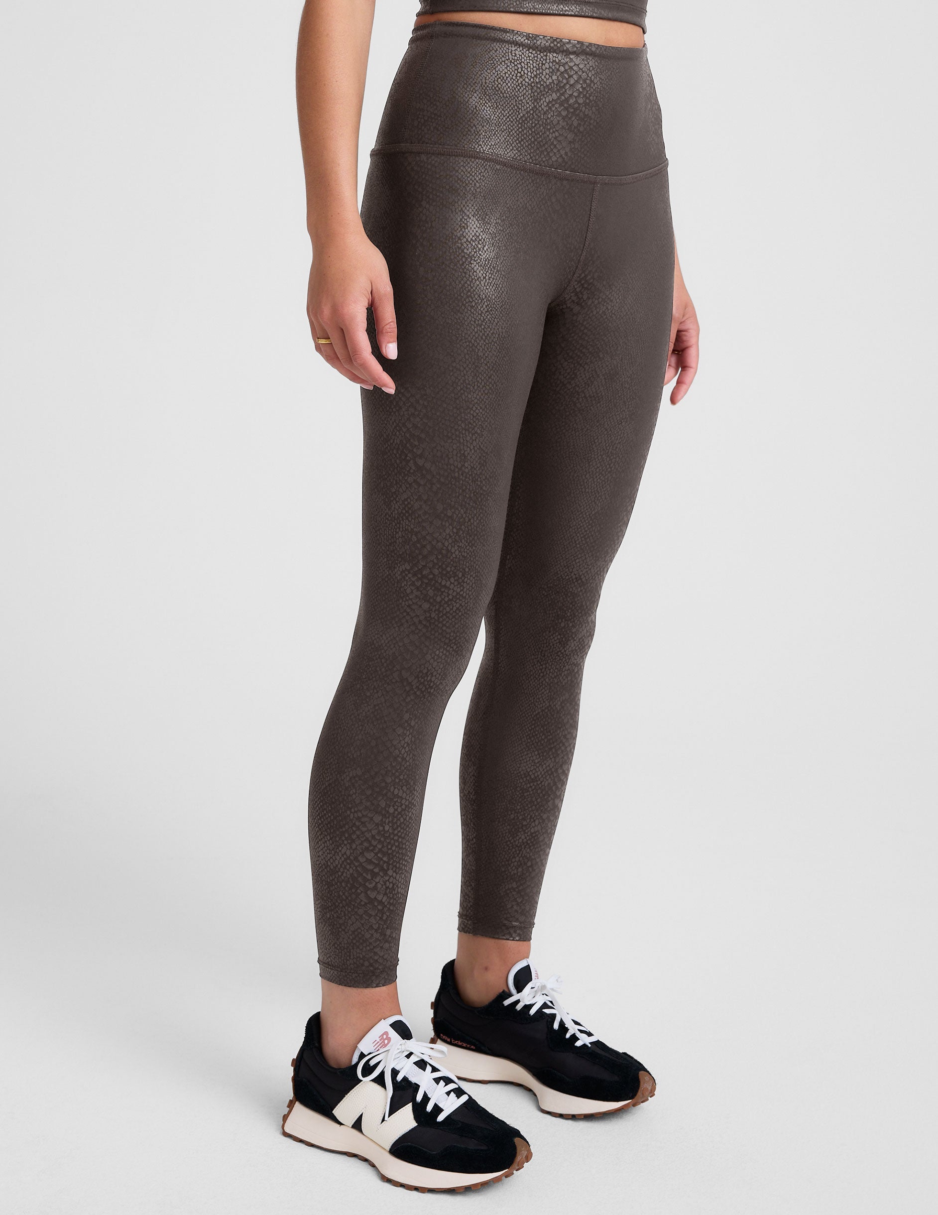 brown viper printed high-waisted midi length leggings.